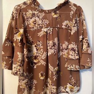 Tan floral blouse, ruffled neckline. Small